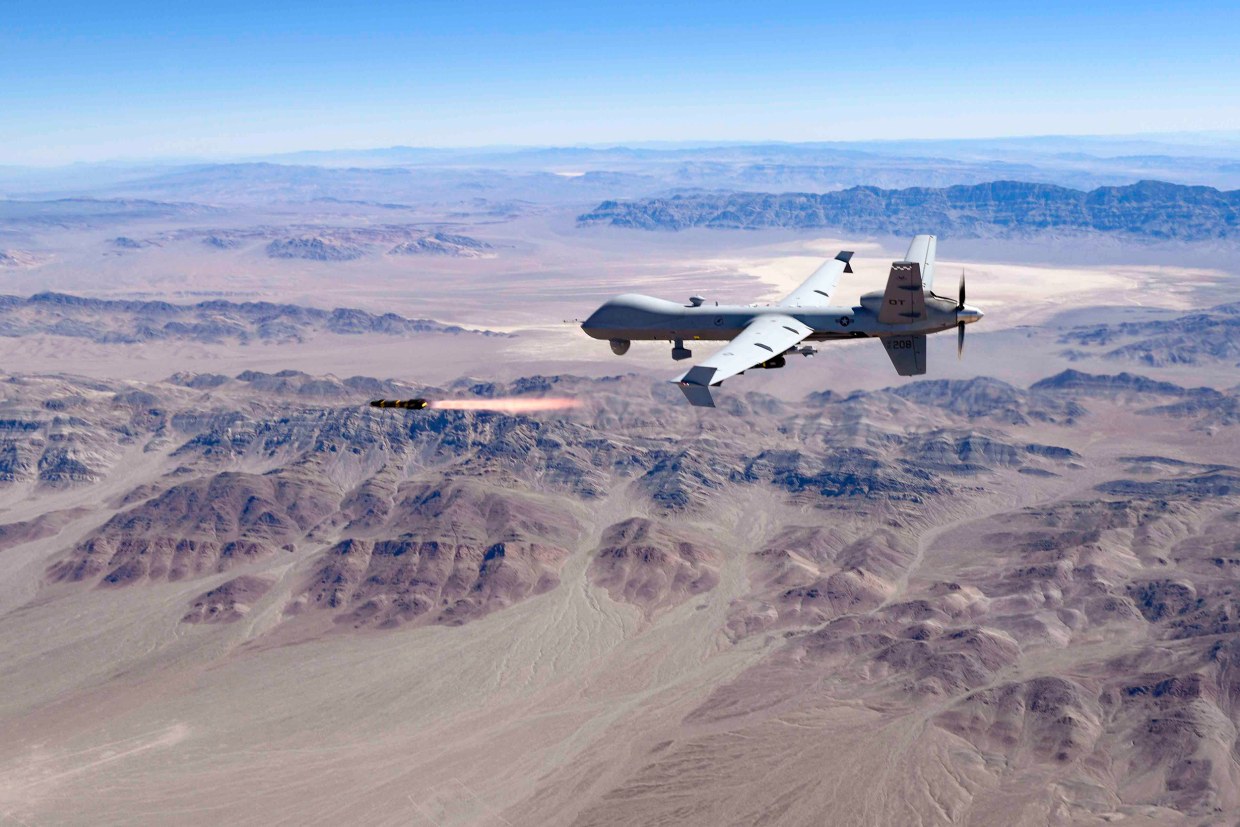 An Air Force MQ-9 Reaper fires a missile over the Nevada Test and Training Range at Nellis Air Force Base last year.