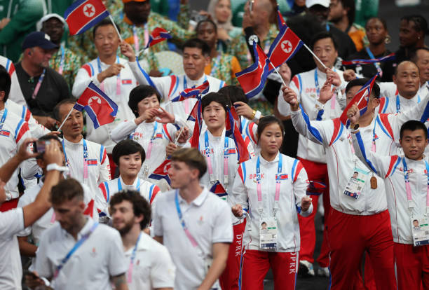 paris-france-athletes-of-team-democratic-peoples-republic-of-korea-wave-their-nations-flag.jpg