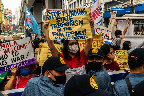 various-militant-groups-carrying-banners-and-placards-hold-a-protest-against-the-visit-of-us.jpg