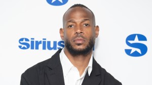 Marlon Wayans poses on a red carpet.