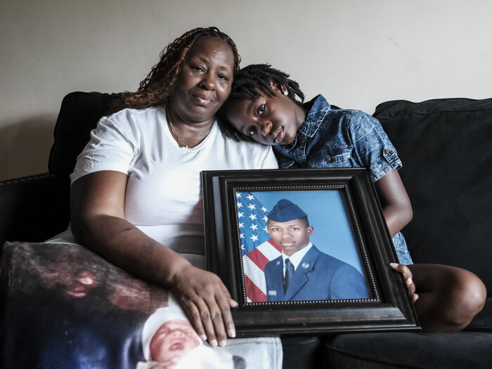 Chantemekki Fortson, mother of Roger Fortson, a U.S. Air Force senior airman, holds a photo of her son.