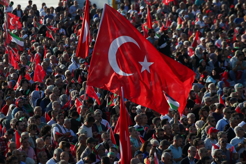 People attend a rally in solidarity with Palestinians in Gaza