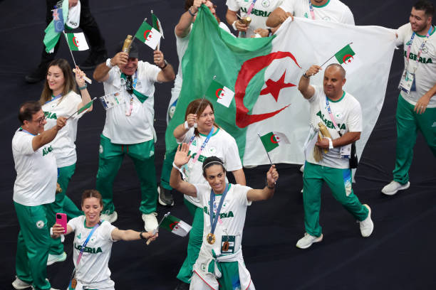 paris-france-athletes-of-team-algeria-wave-their-nations-flag-during-the-closing-ceremony-of.jpg