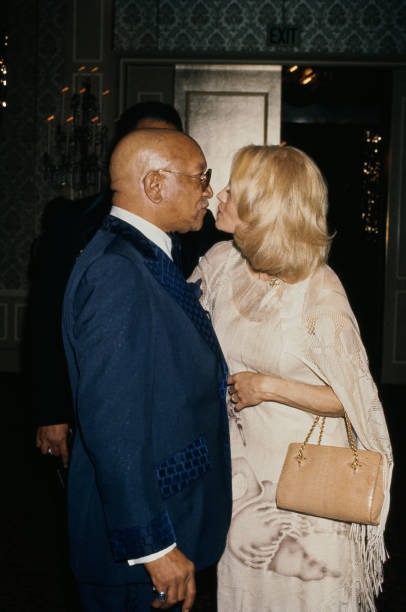 angie-dickinson-and-comedian-redd-foxx-share-a-kiss-during-a-red-carpet-event-united-states.jpg