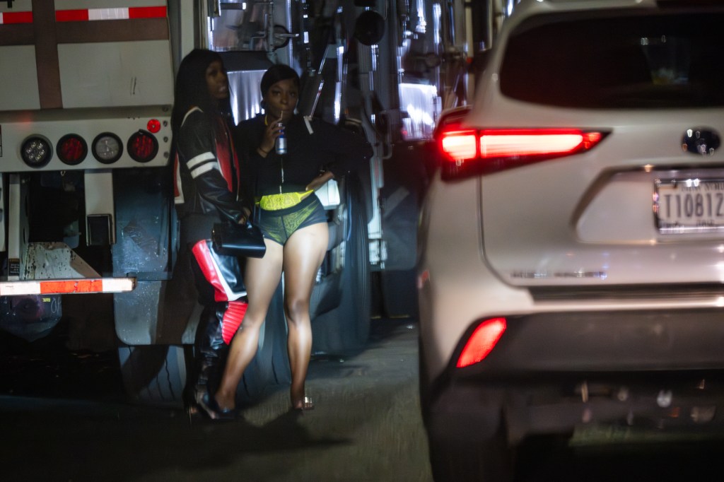 Two prostitutes standing next to a truck on Georgia Avenue in Brooklyn, NY