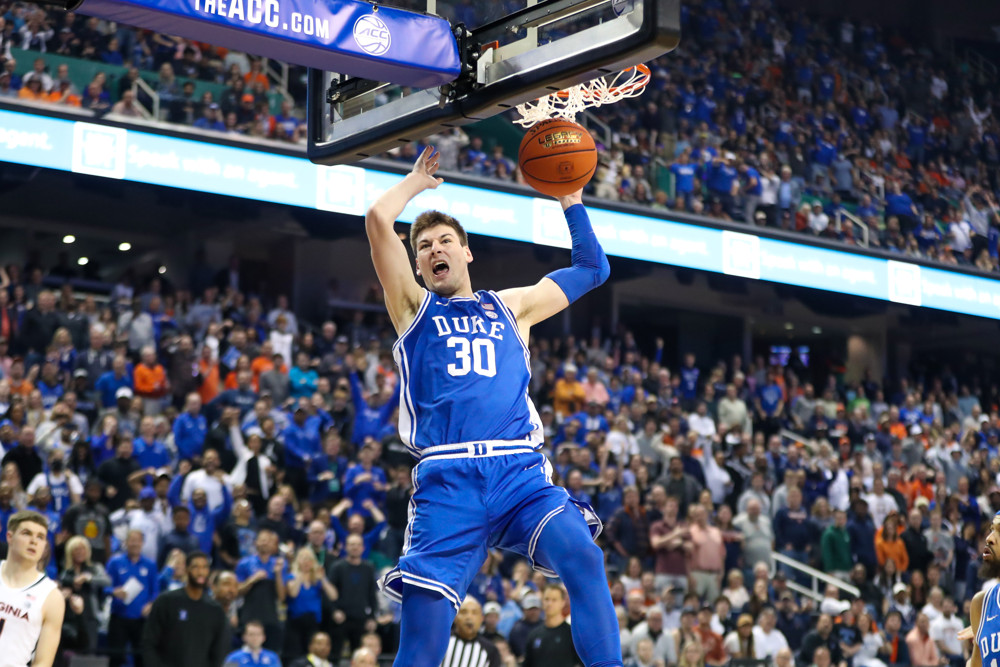 GREENSBORO, NC - MARCH 11: Kyle Filipowski (30) of the Duke Blue Devils dunks the ball during the ACC Championship against the Virginia Cavaliers on March 11, 2023 at Greensboro Coliseum in Greensboro, NC. (Photo by David Jensen/Icon Sportswire)