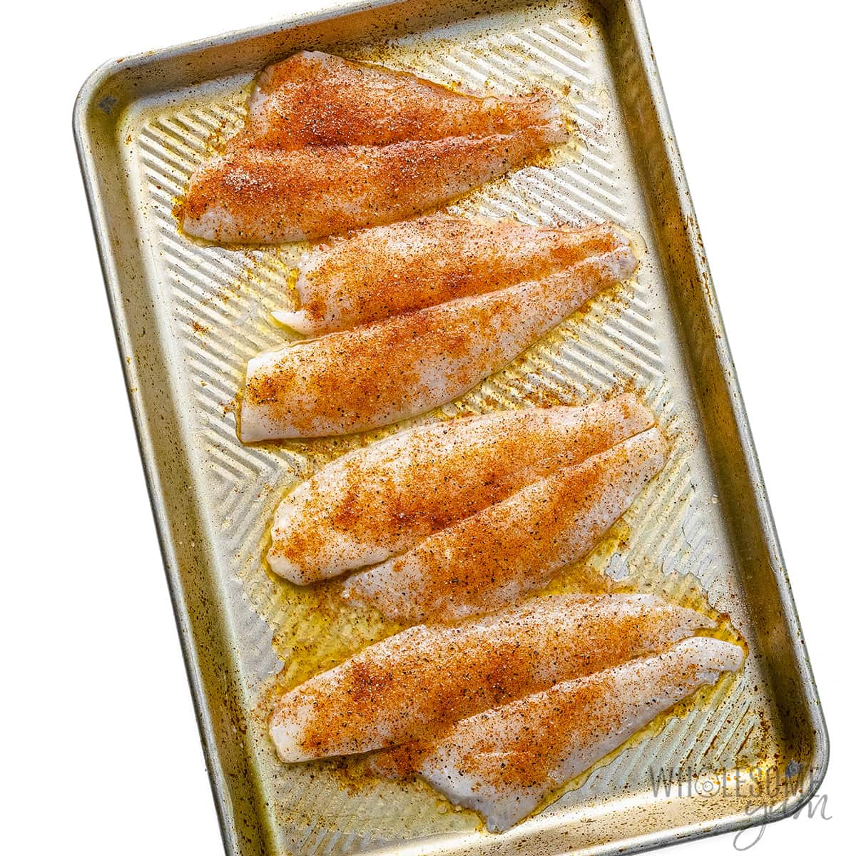 Fish with seasoning mixture on it.