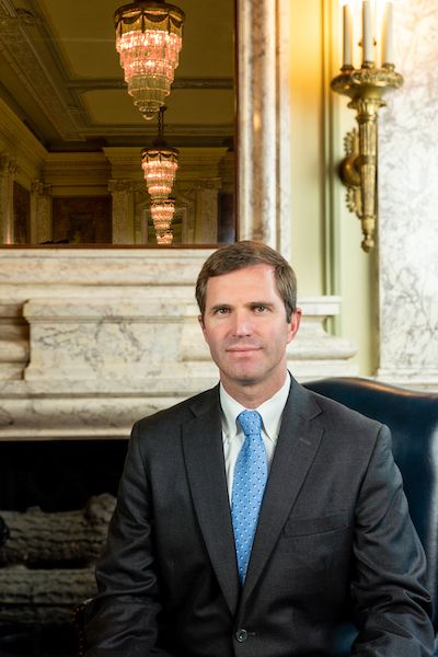 Governor Andy Beshear sitting in the Capitol Building.