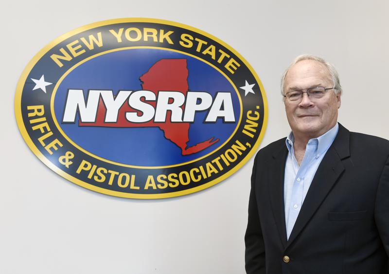 New York State Rifle & Pistol Association president Tom King poses for a photo Thursday, Oct. 28, 2021, in East Greenbush, N.Y. The Supreme Court is about to hear a gun rights case that could lead to more guns on the streets of New York and Los Angeles and threaten bans on guns in subways, airports, bars, churches, schools and other places where people gather. (AP Photo/Hans Pennink)