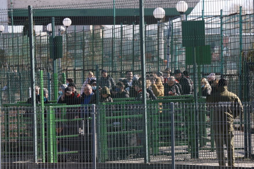 People cross the border between Poland and Ukraine