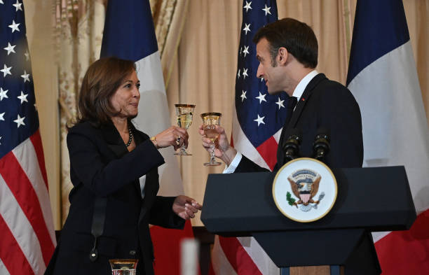 us-vice-president-kamala-harris-makes-a-toast-with-french-president-emmanuel-macron-during-a.jpg