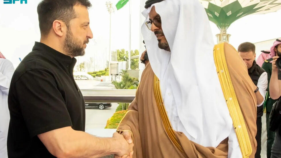 Ukraine's President Volodymyr Zelensky is welcomed by Mecca deputy governor Saud bin Mishaal bin Abdulaziz Al-Saud at Jeddah airport.