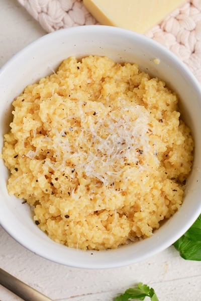 close up bowl of creamy italian pastina with cheese