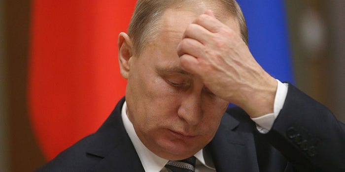 Putin scratching his forehead