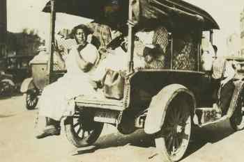 Tulsa-Race-Riot-Black-Wall-Street-women-taken-prisoner-in-paddy-wagon-armed-guard-060121-by-Tulsa-Historical-Society-web.jpg