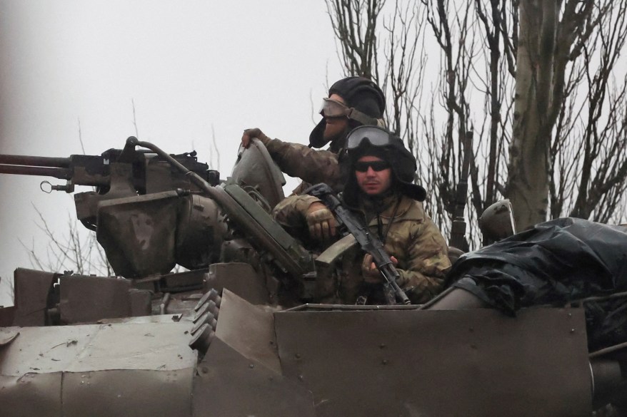 Ukrainian tanks move into the city, after Russian President Vladimir Putin authorized military operation in eastern Ukraine, in Mariupol