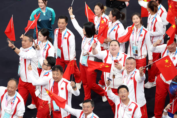 paris-france-athletes-of-team-peoples-republic-of-china-wave-small-flags-during-the-closing.jpg