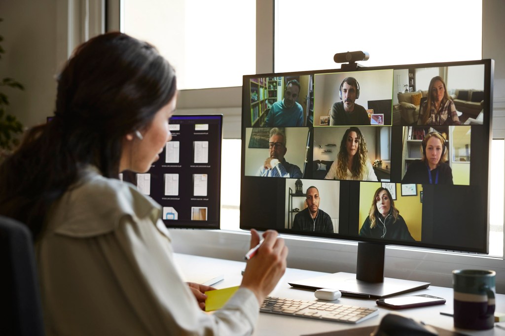 A woman in a video meeting.