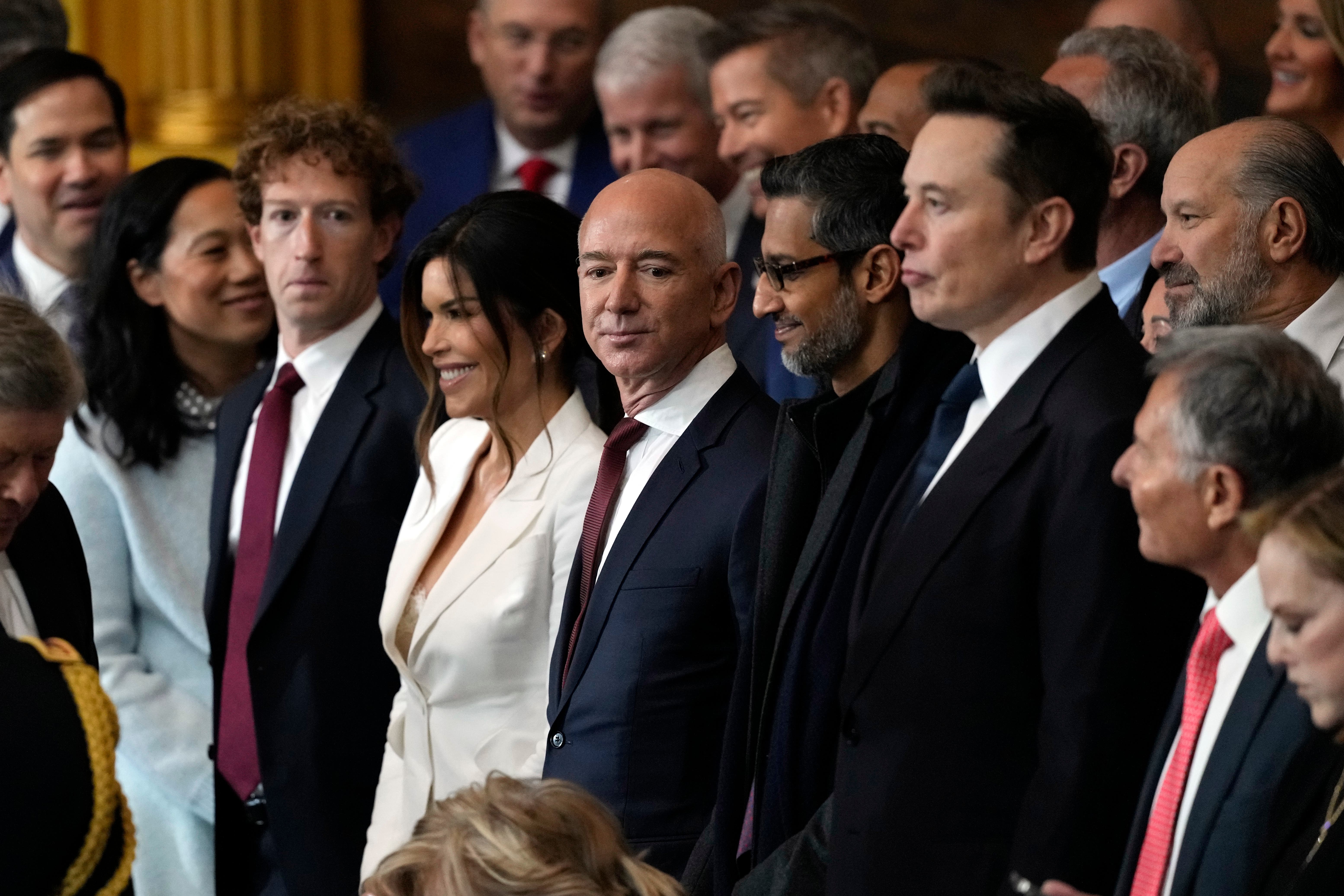 Google CEO Sundar Pichai nestled between Amazon boss Jeff Bezos and Tesla chief Elon Musk at Donald Trump’s inauguration