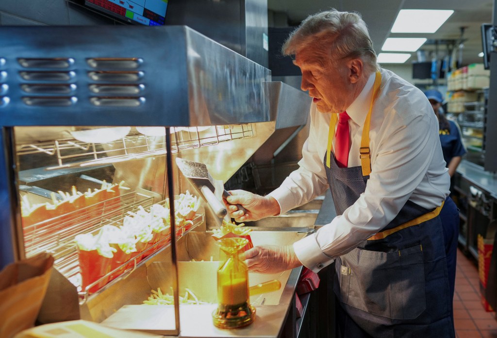 Trump scoops french fries for customers.