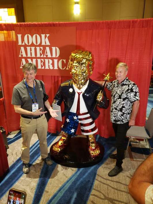 Trump-golden-statue-with-two-men.jpg