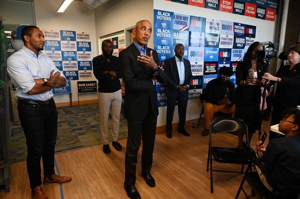 Former U.S. President Barack Obama talks to supporters at a campaign field office in East Liberty, ahead of a rally in support of Vice President Kamala Harris, in Pittsburgh, Pennsylvania, U.S. on Oct. 10, 2024. 