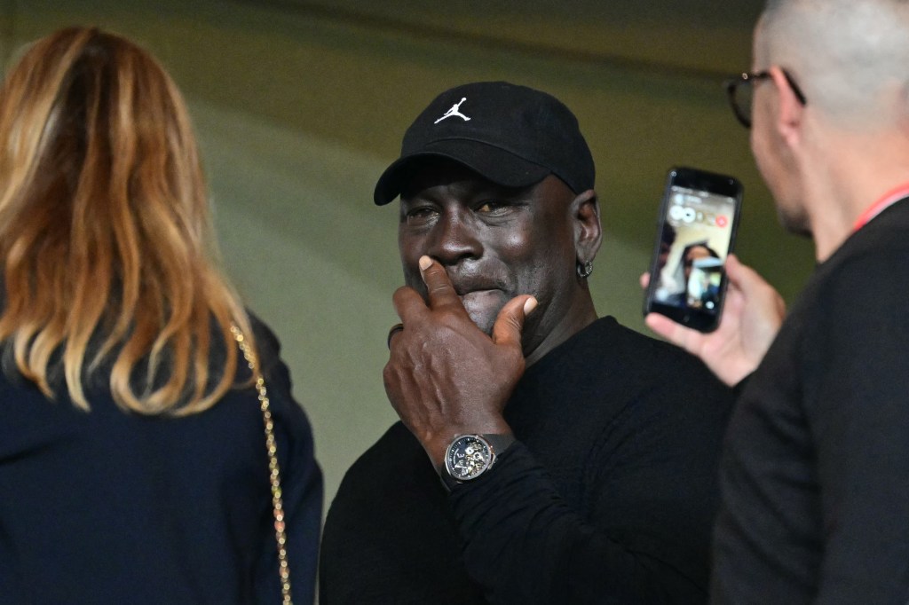 Michael Jordan (C) attends the UEFA Champions League 1st round day 1 football match between AS Monaco and FC Barcelona