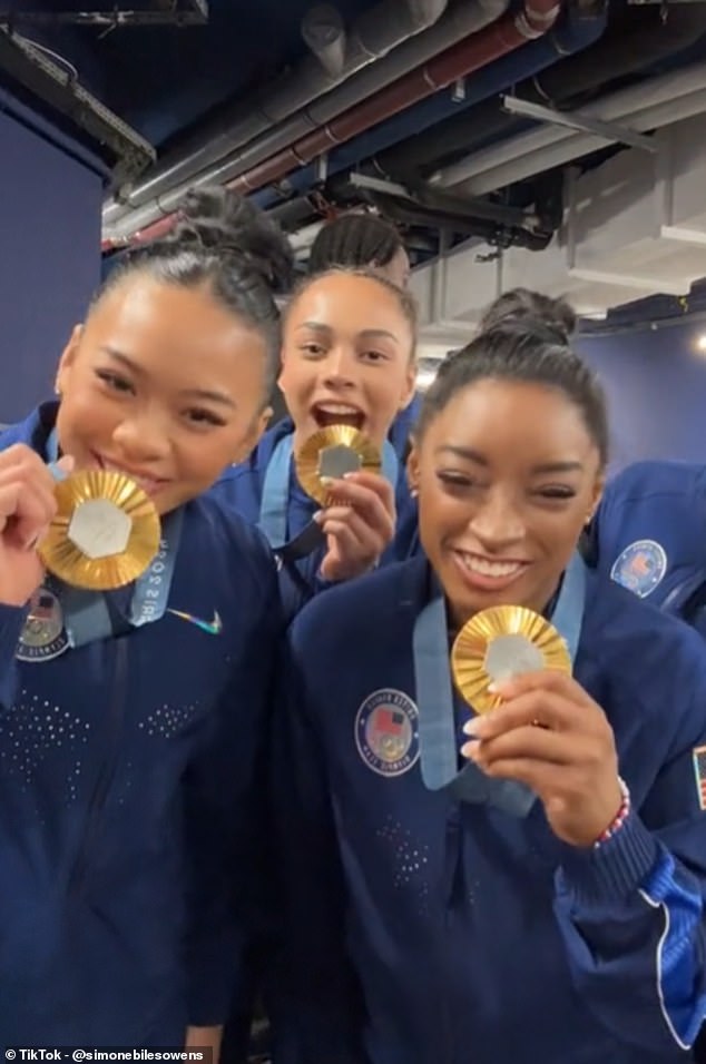 87964563-13690737-Simone_Biles_lead_her_team_in_celebrations_after_securing_gold_m-a-103_1722380441449.jpg