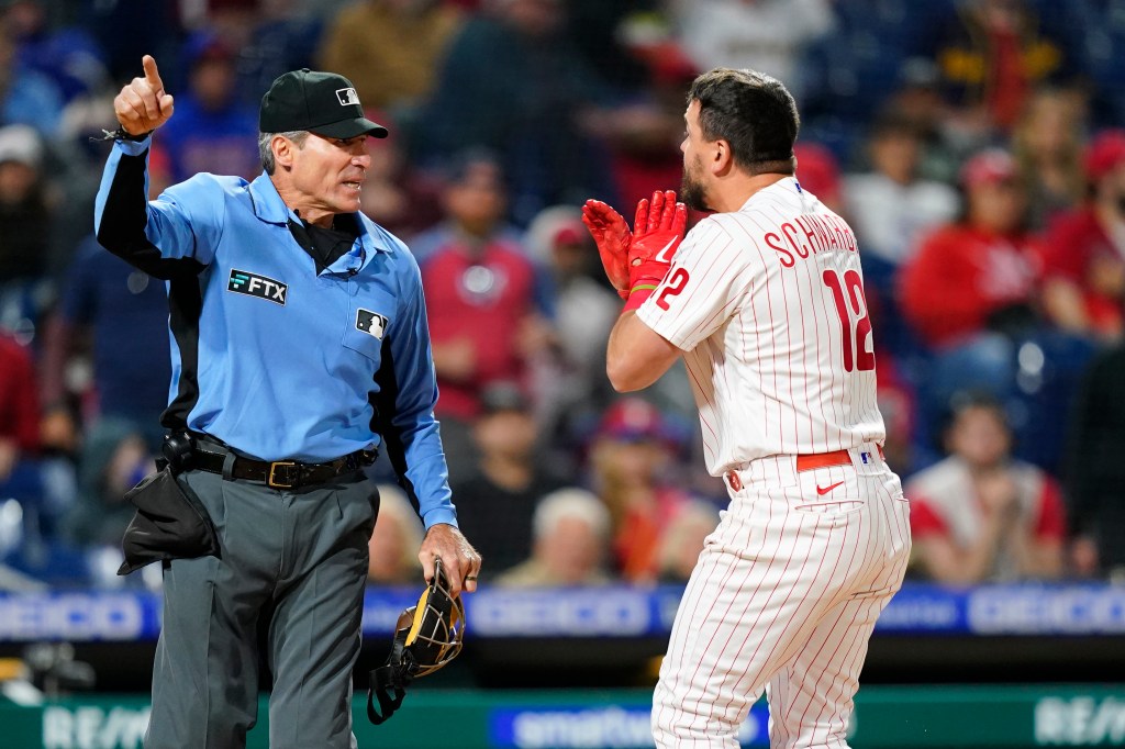 Kyle Schwarber of the Phillies argues with umpire Angel Hernandez on April 24, 2022.