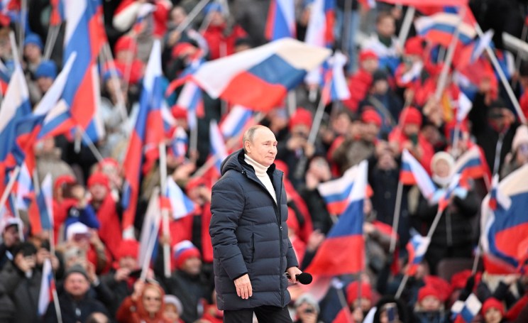 Russian President Vladimir Putin delivers a speech during a concert marking the eighth anniversary of Russia's annexation of Crimea at Luzhniki Stadium in Moscow, Russia March 18, 2022. Sputnik/Ramil Sitdikov/Kremlin via REUTERS ATTENTION EDITORS - THIS IMAGE WAS PROVIDED BY A THIRD PARTY.