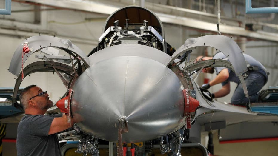 aircraft mechanics working on a plane