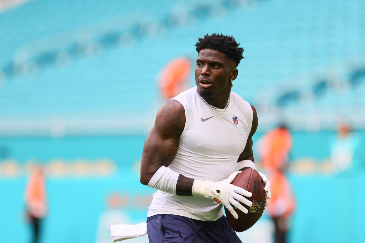 Miami Dolphins wide receiver Tyreek Hill (10) throws the football before preseason game against the Washington Commanders at Hard Rock Stadium.