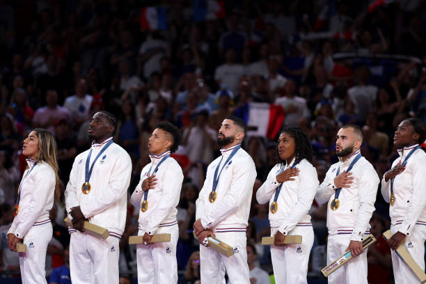 paris-france-gold-medalists-team-france-stands-on-the-podium-at-the-judo-mixed-team-medal.jpg