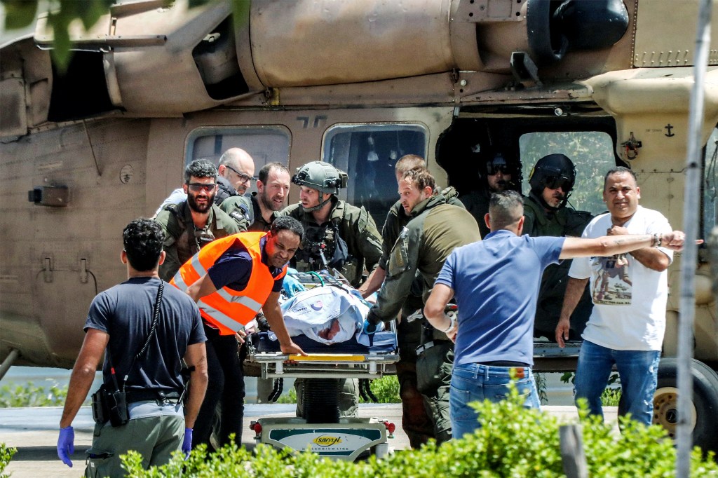 Injured person being evacuated from an Israeli air force helicopter at Sheba Tel-HaShomer Medical Centre, following a hostage rescue operation