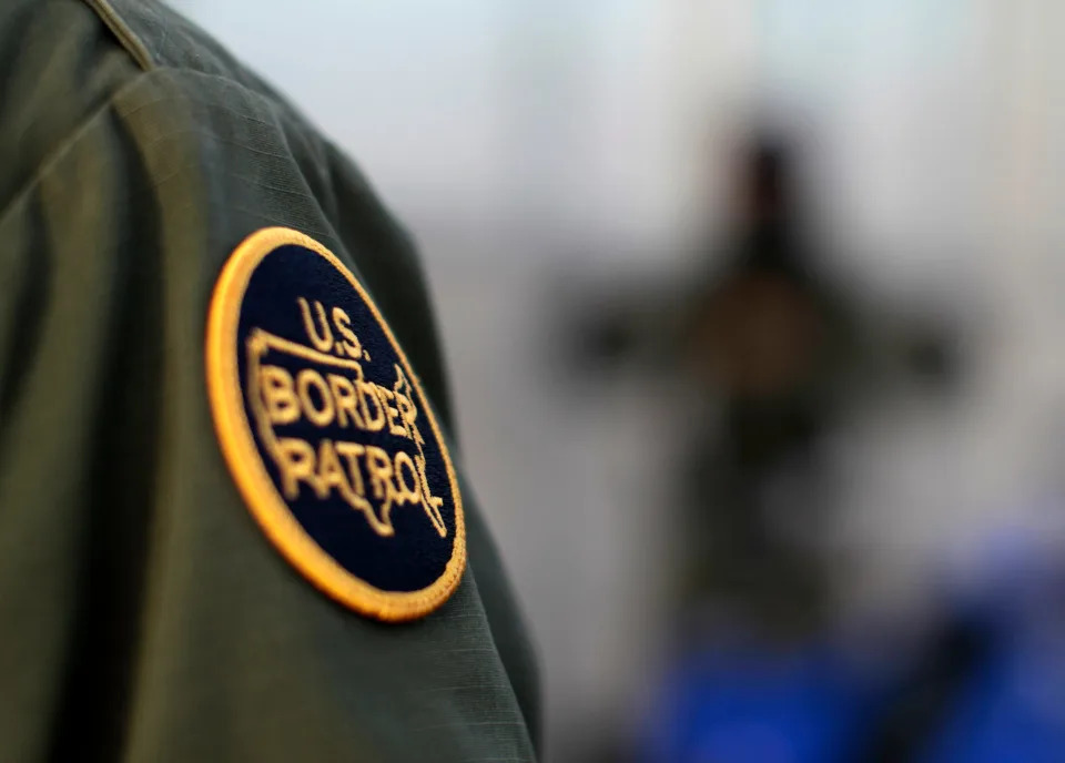 A patch is shown on the uniform of a U.S. Customs and Border Patrol agent near the international border between Mexico and the United States south of San Diego, California, March 26, 2013.