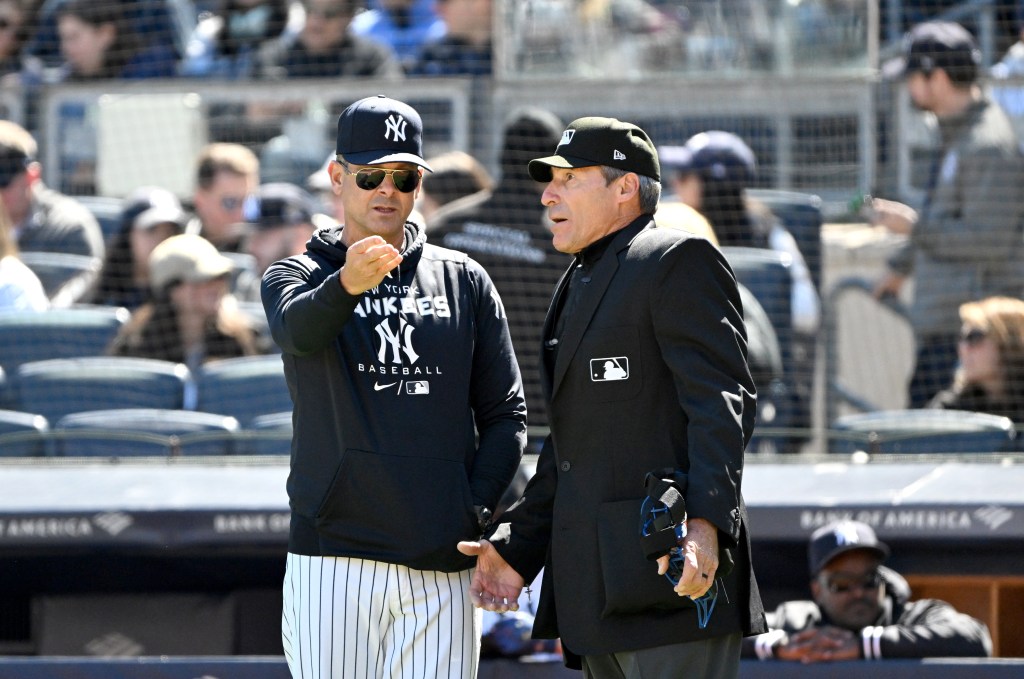 Yankees manager Aaron Boone argues with umpire Angel Hernandez on April 7, 2024.