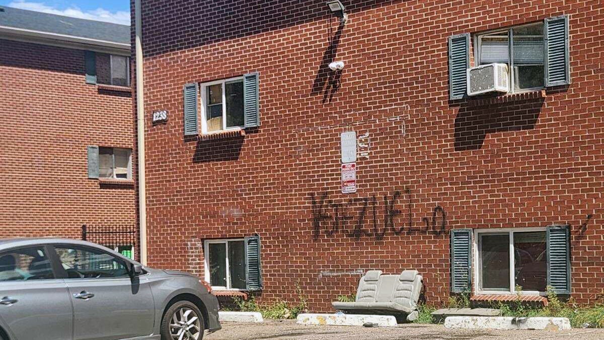 Occupied apartment building with Venezuela graffiti