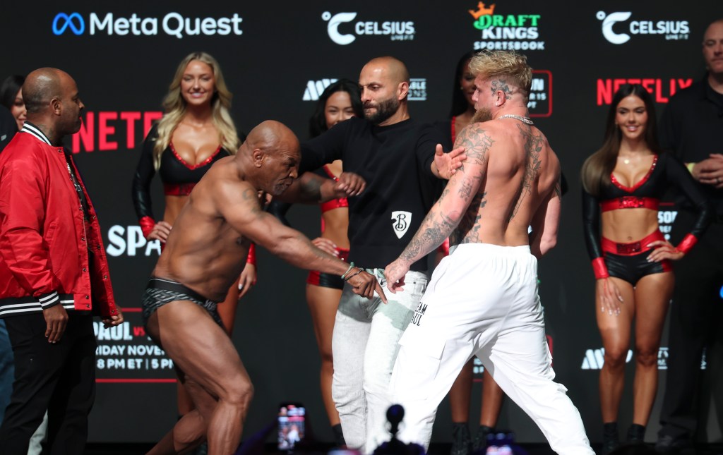 Jake Paul and Mike Tyson face off during weigh-ins at the Toyota Music Factory