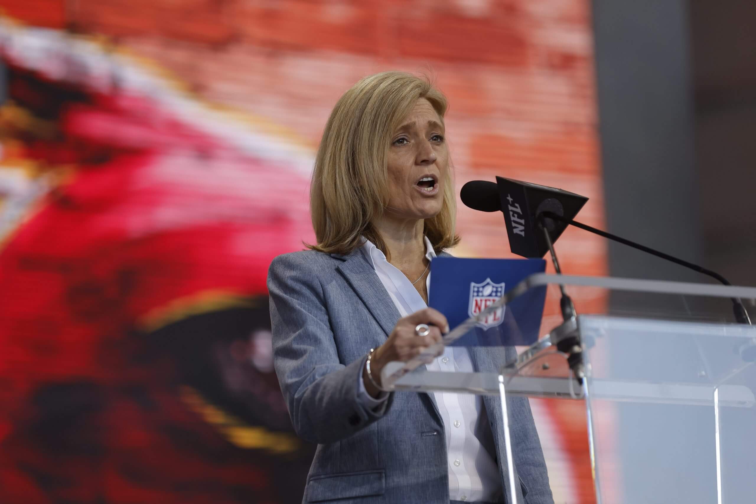 Dawn Aponte, Chief Football Administrative Officer with the NFL, announces a fourth round draft pick selection during the 2023 NFL Draft at Union Station on April 29, 2023 in Kansas City, Missouri.