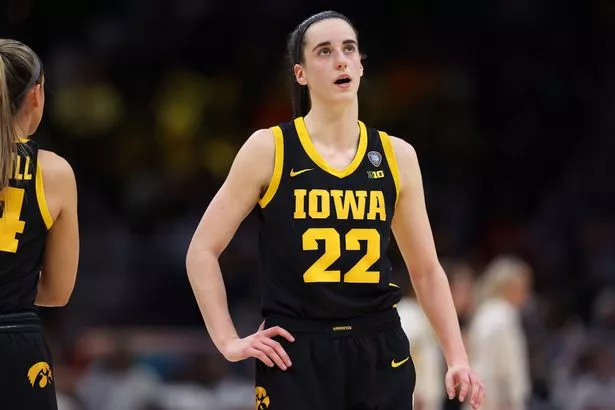 Caitlin Clark #22 of the Iowa Hawkeyes looks on in the first half during the 2024 NCAA Women's Basketball Tournament National Championship game