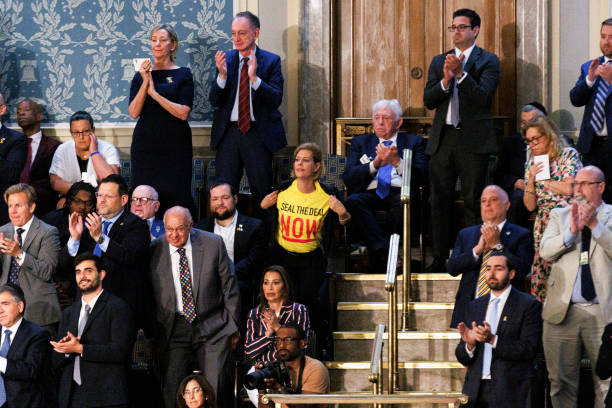 washington-dc-united-states-a-person-wearing-a-yellow-pro-palestinian-shirt-reading-seal-the.jpg