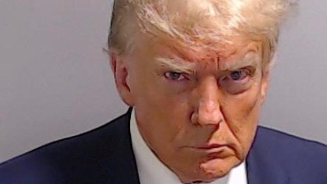 Scowling Trump makes history with first presidential mugshot