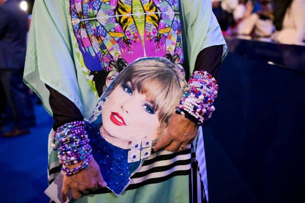 a-delegate-carries-an-image-of-singer-taylor-swift-during-the-democratic-national-convention.jpg