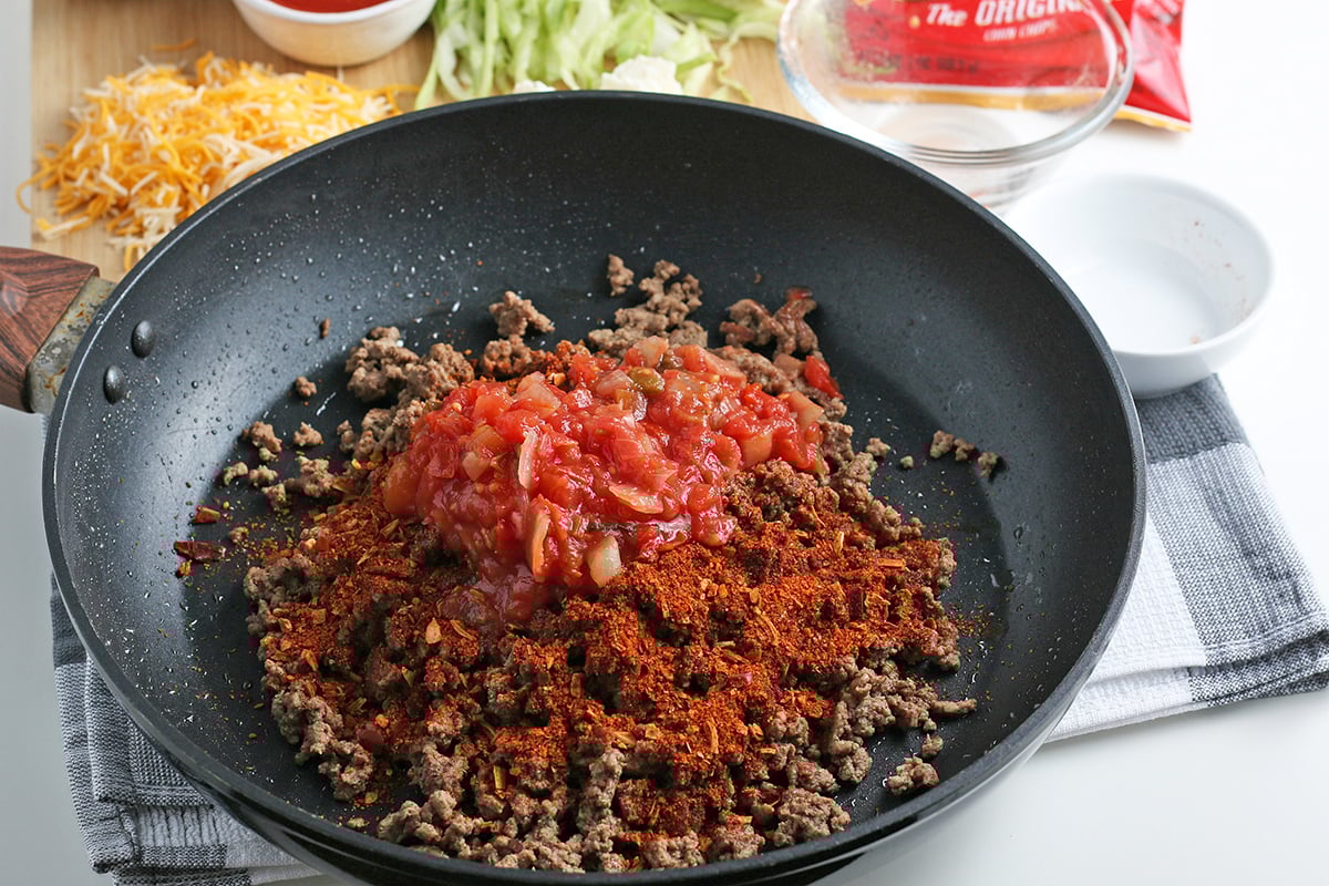 salsa and taco seasoning in pan of ground beef salsa and taco seasoning in pan of ground beef